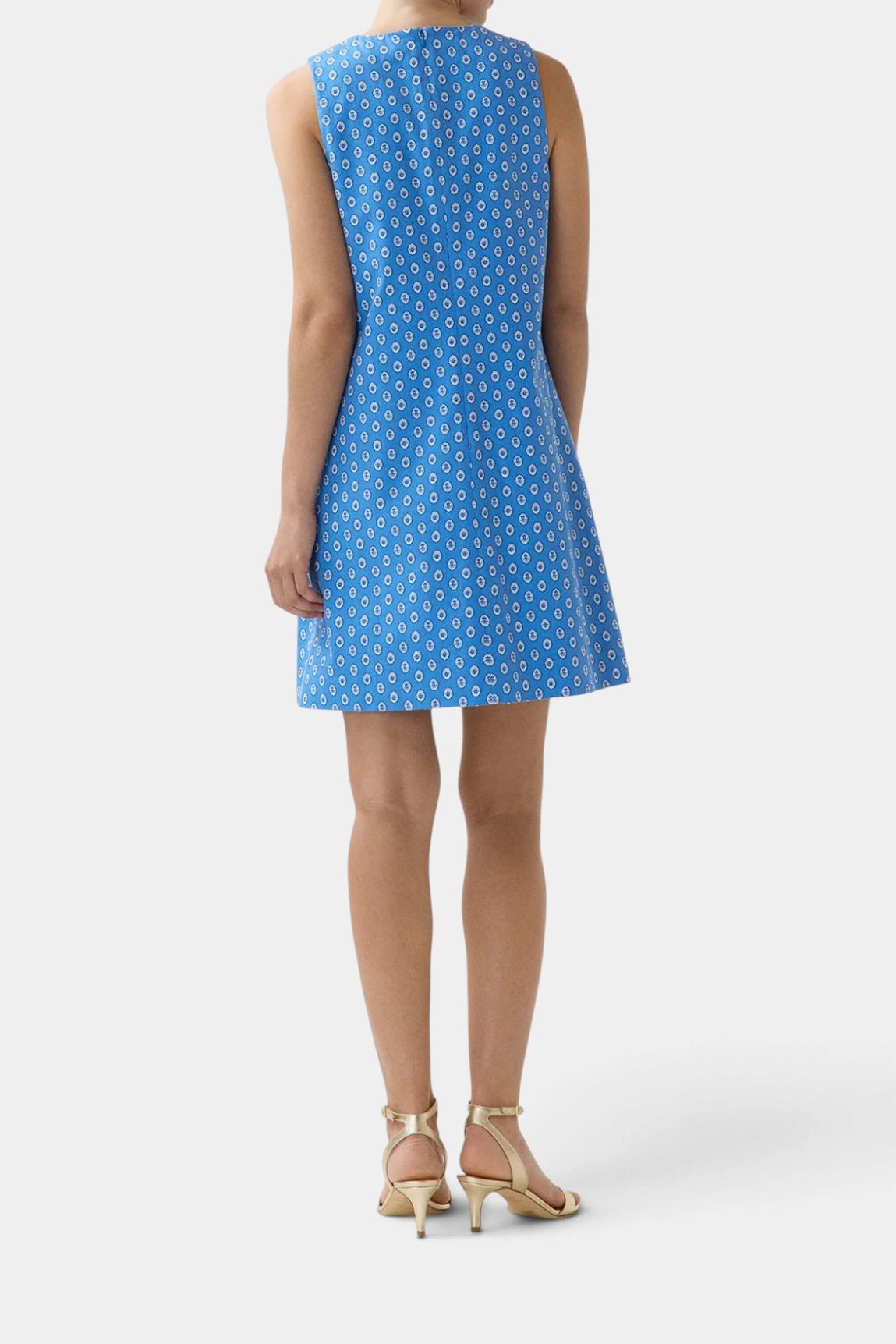 The Copper Shed Susy shift dress in blue cotton poplin with a white geometric print, shown from the back view.
