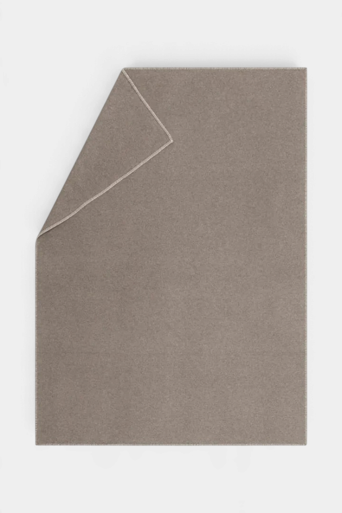 The Copper Shed SYLT solid taupe recycled cotton blanket with decorative stitched edges for home decor.