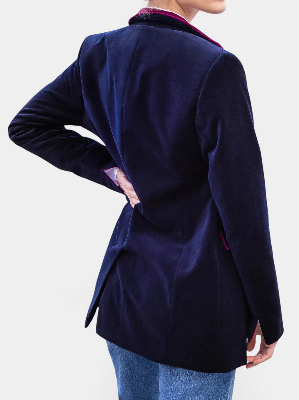 The Copper Shed Tamara Austrian velvet blazer in navy blue with deep purple and pink trim, back view on a model.
