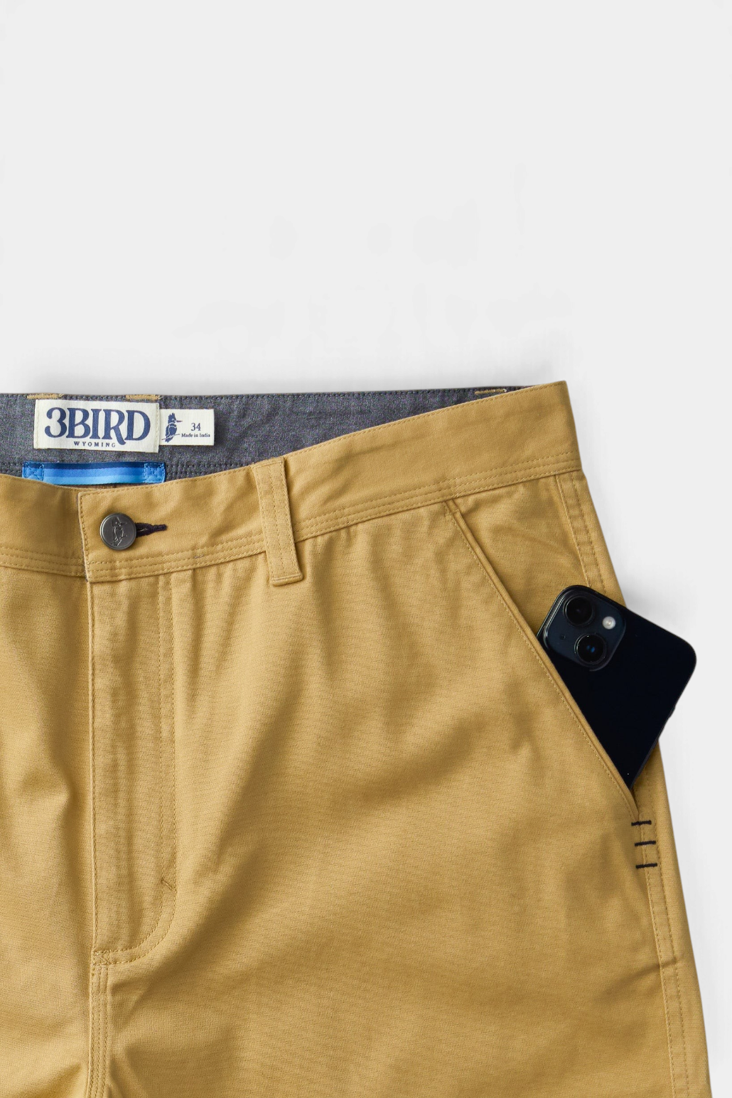 The Copper Shed Breakout Broken Twill Shorts in tan organic cotton with front slash pocket and triple-stitch detail.