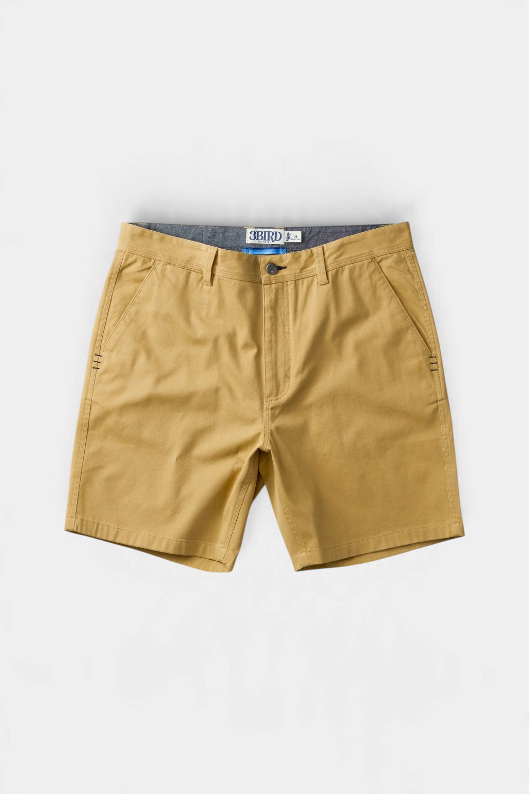 The Copper Shed Breakout broken twill shorts in tan organic cotton with triple-stitch detail and front slash pockets.