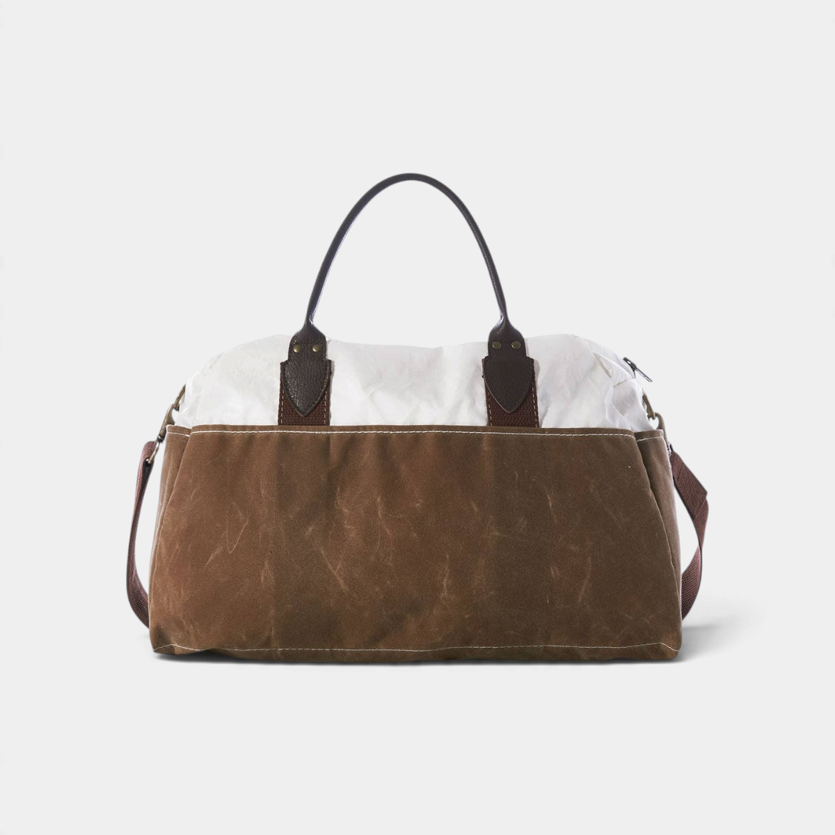 The Copper Shed Tan Chebeague Weekender bag in recycled white sail cloth and brown waxed canvas with leather handles.