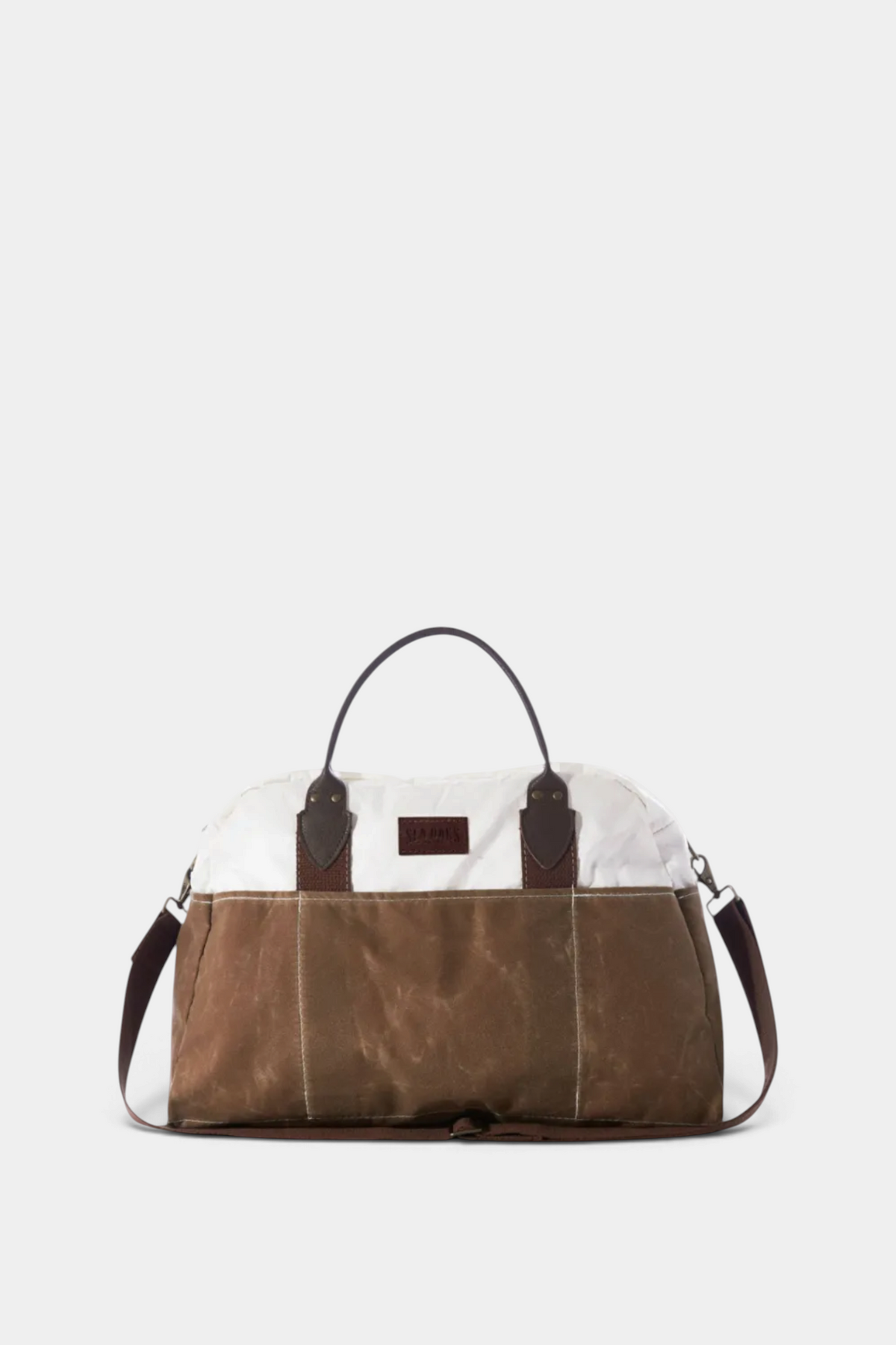 The Copper Shed Tan Chebeague Weekender bag in recycled sail cloth and waxed canvas with leather handles and strap.