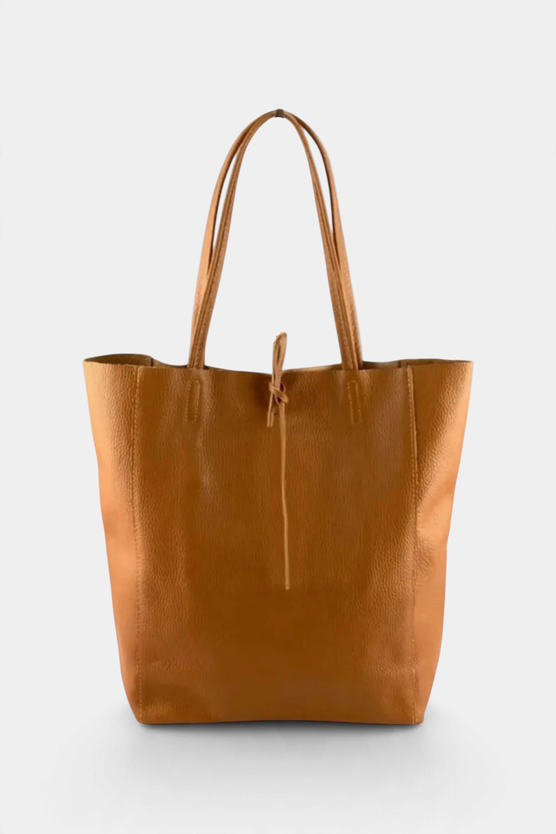 The Copper Shed Italian leather tote bag in tan with long shoulder straps and a simple tie closure