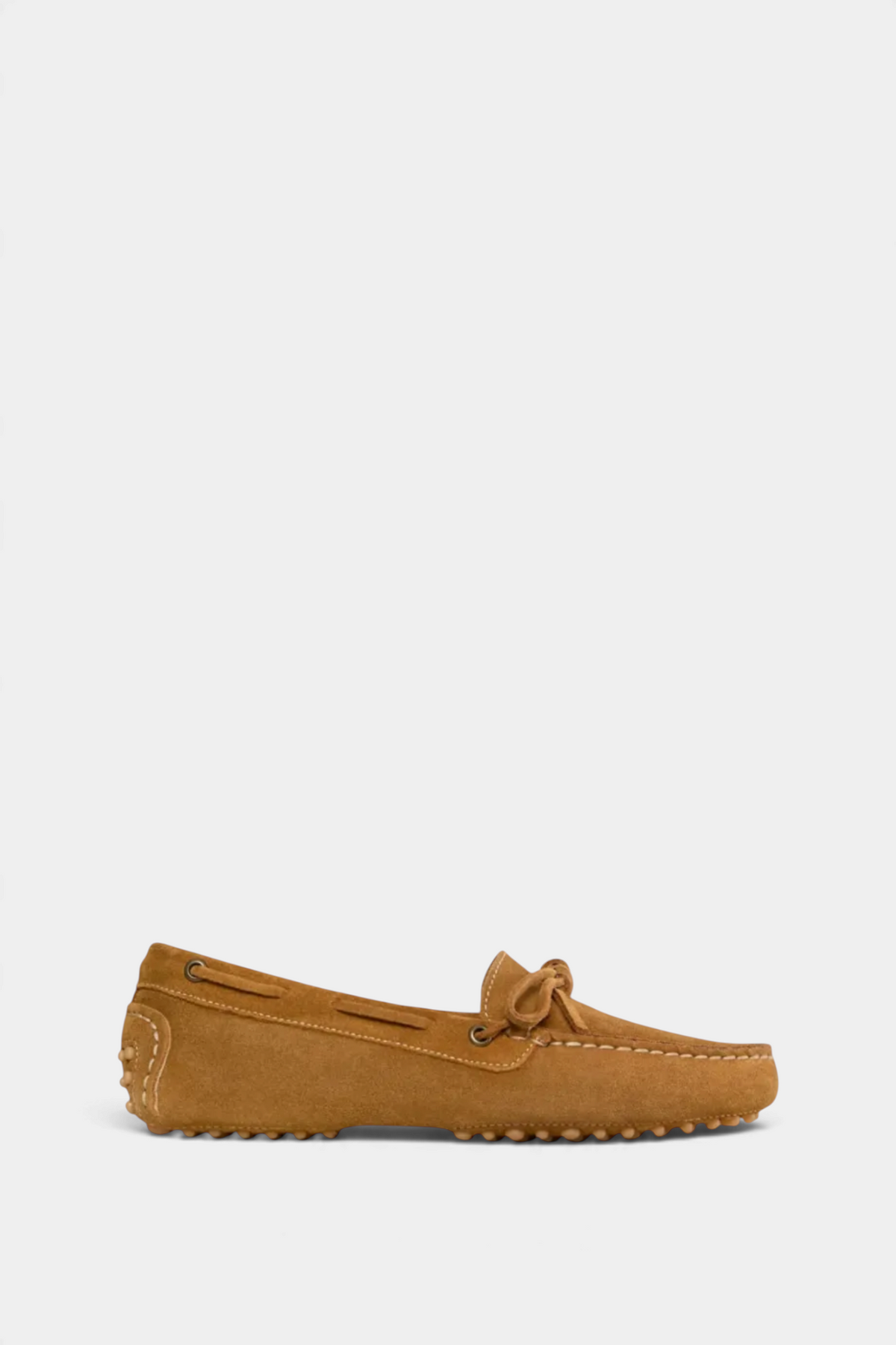 The Copper Shed tan suede driving moccasins with rubber studded soles and a classic slip-on design.