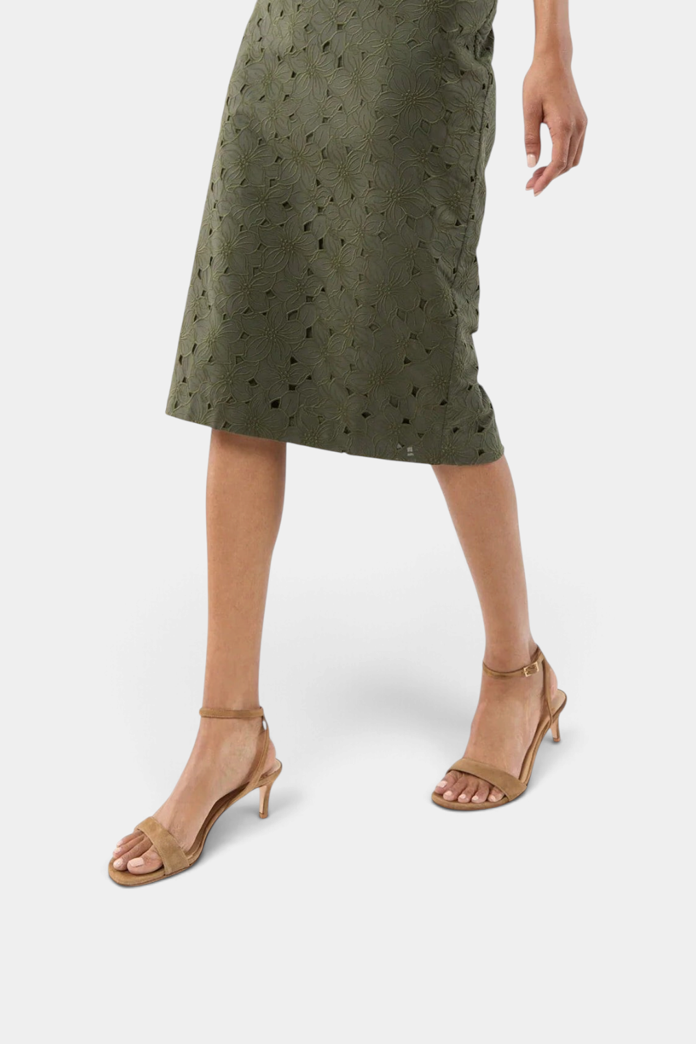 The Copper Shed ankle wrap kitten heels in tan calf suede with a buckle closure worn with an olive green skirt