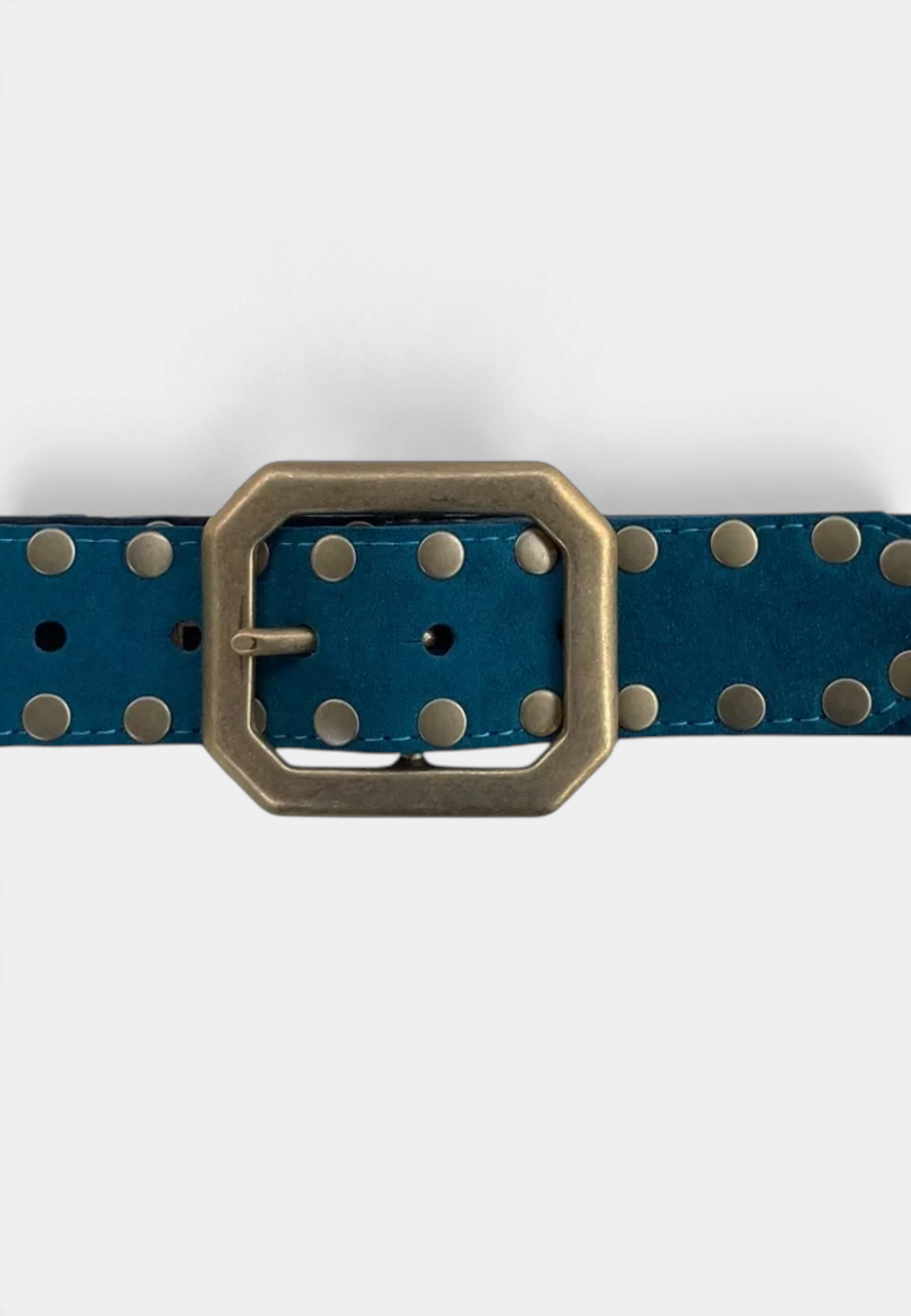 The Copper Shed teal suede belt featuring a rectangular squared-off buckle and metallic stud detailing.