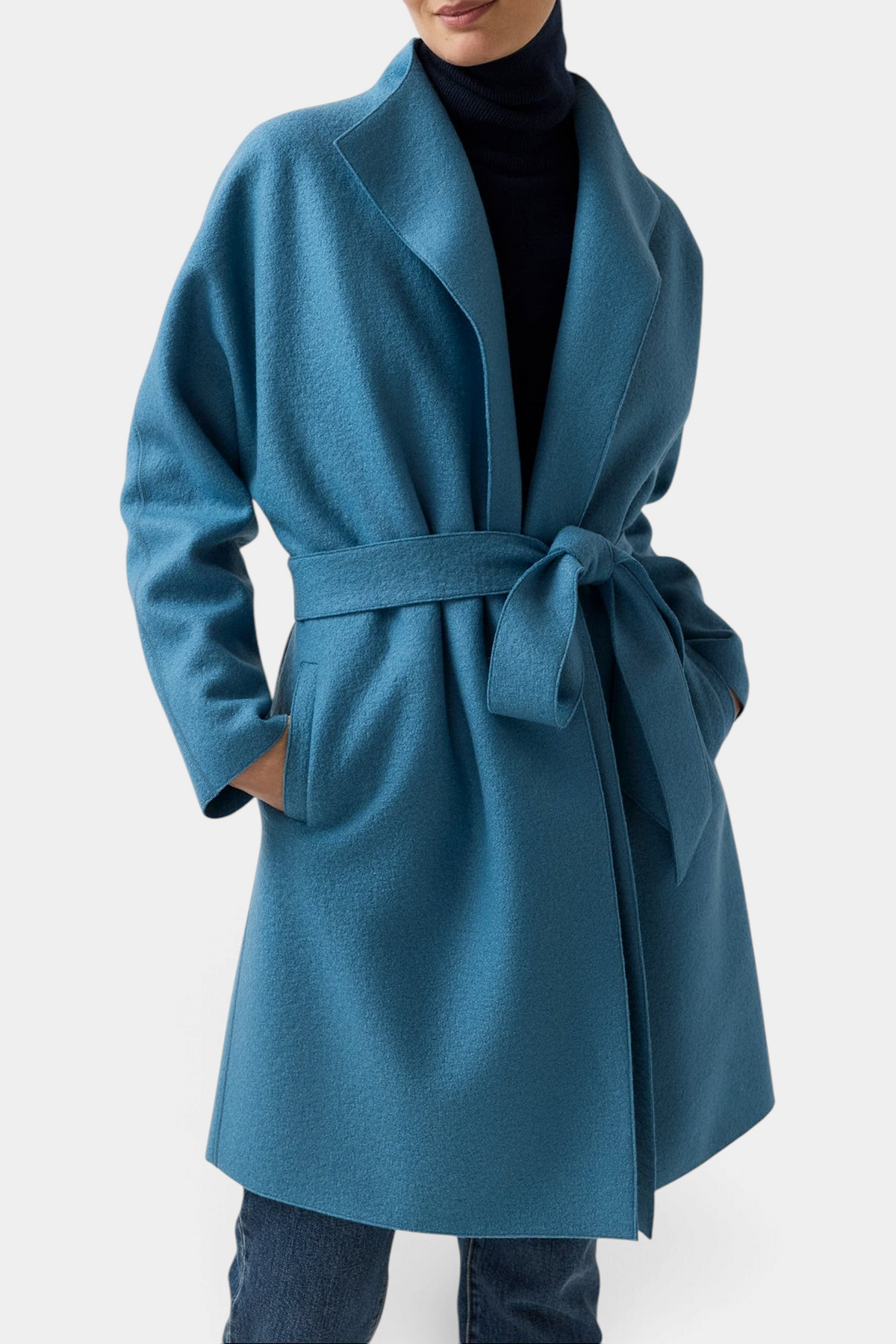 The Copper Shed Kimono Carina wrap coat in teal blue Italian boiled wool with a belted waist and shawl collar.