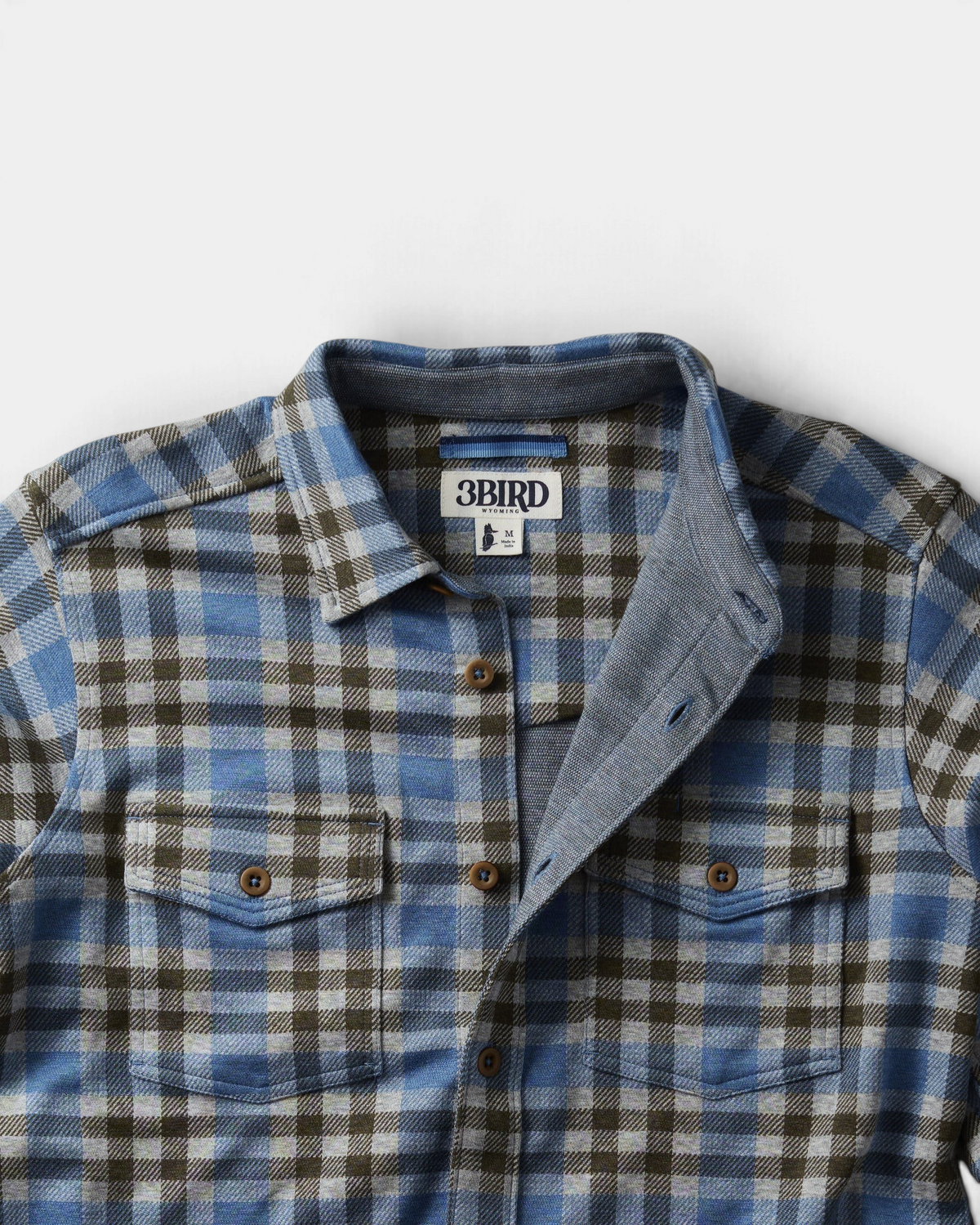 The Copper Shed Tidal knit shirt in a blue and grey plaid cotton modal blend with dual chest pockets