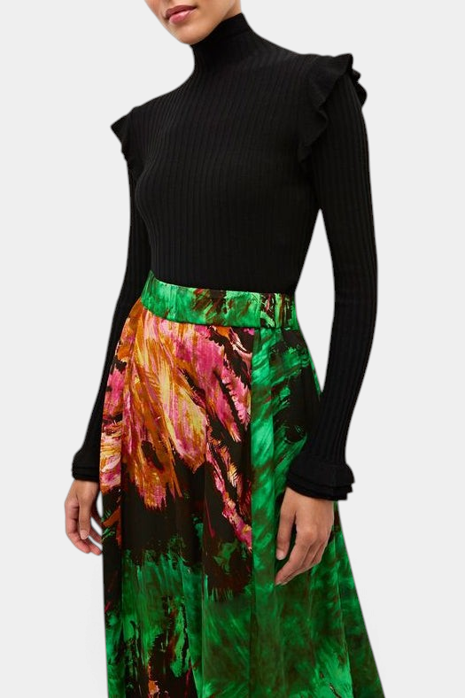 The Copper Shed Tinley black ribbed turtleneck sweater featuring ruffle trim on the shoulders and cuffs.