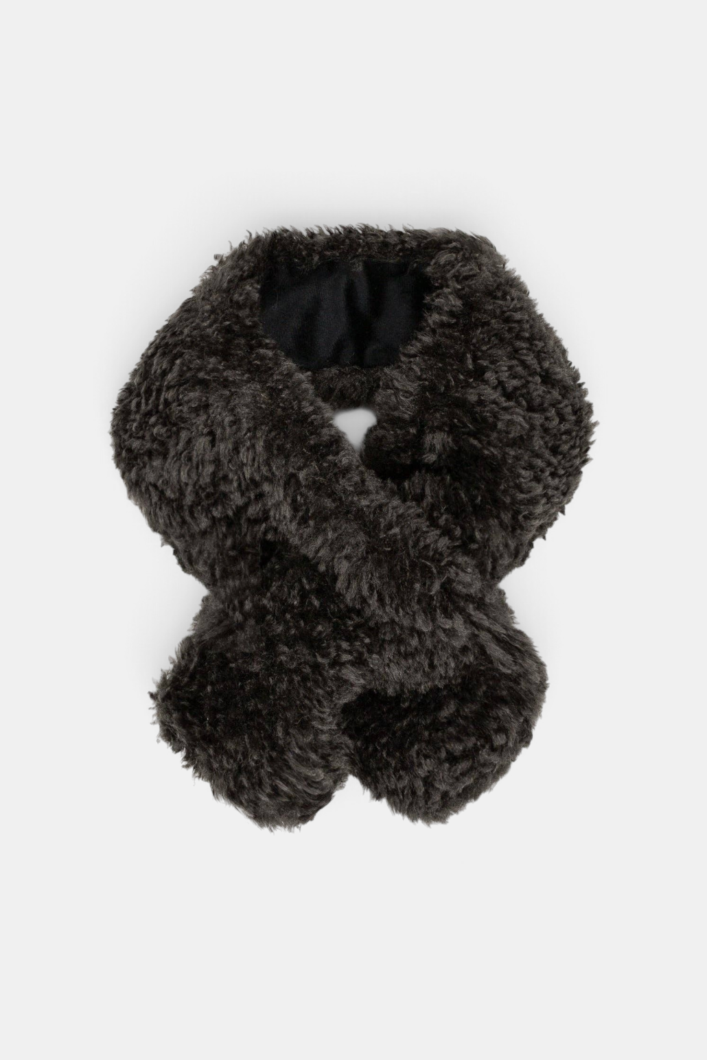 The Copper Shed Tiptop dark brown faux sheepskin scarf with a crossover tuck-through design and velvet lining.