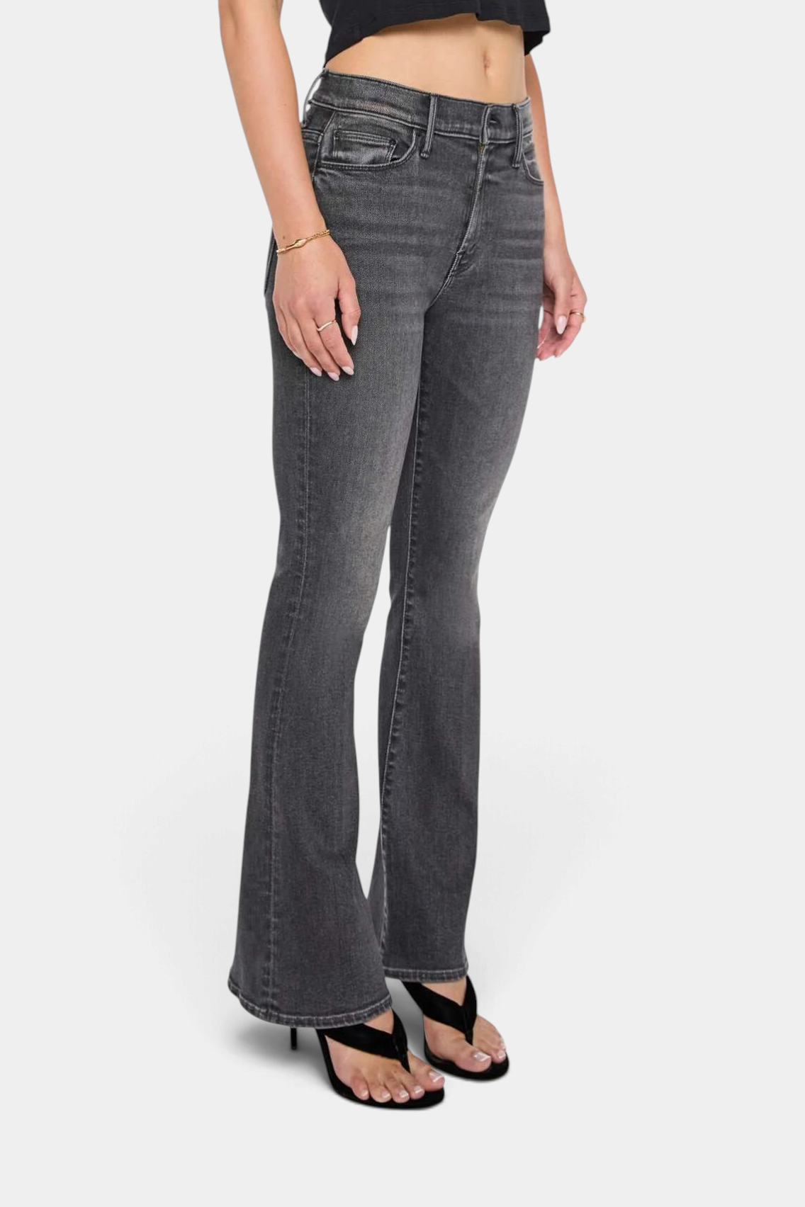 The Copper Shed The Weekender mid-rise flare jeans in washed black denim with a clean hem on a model