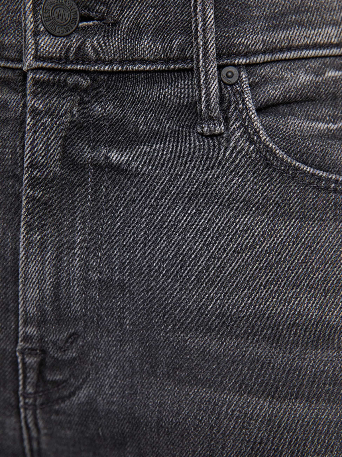 The Copper Shed The Weekender mid-rise flare jeans in washed black denim with metal button and pocket detail.