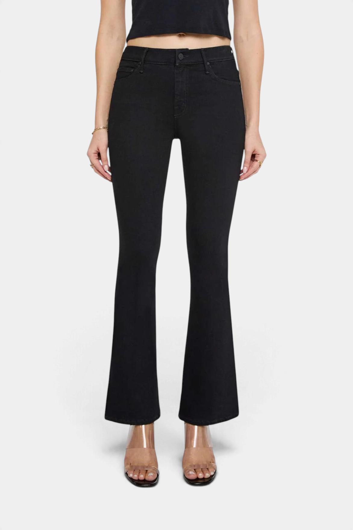 The Copper Shed The Weekender mid-rise black flare jeans with a clean hem worn by a model
