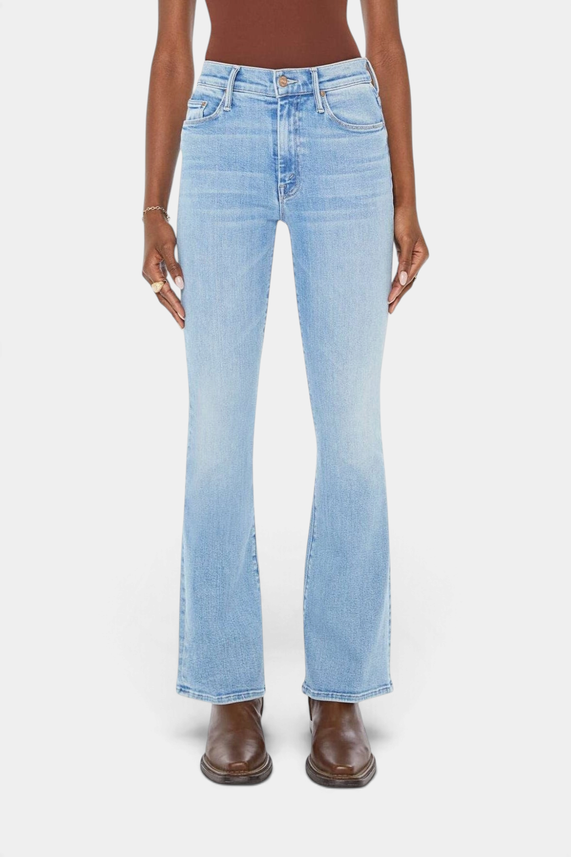 The Copper Shed The Weekender mid-rise flare jeans in a light blue stretch denim wash with subtle fading and whiskering.