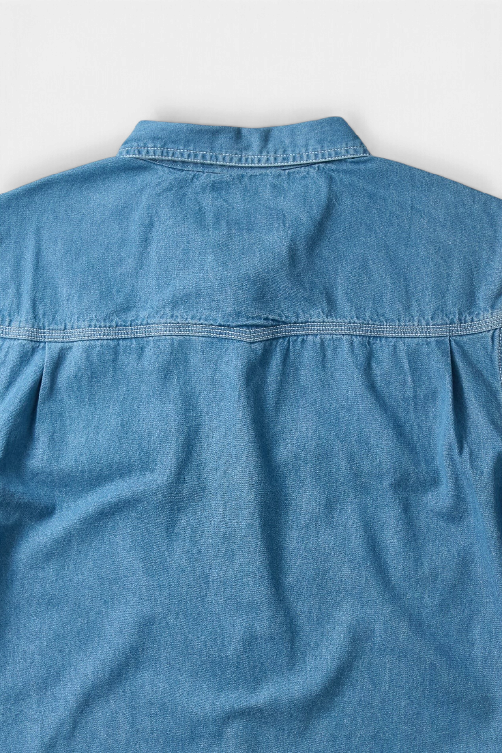 The Copper Shed Westside denim shirt back view featuring signature WingSpan yoke and light blue cotton denim fabric.