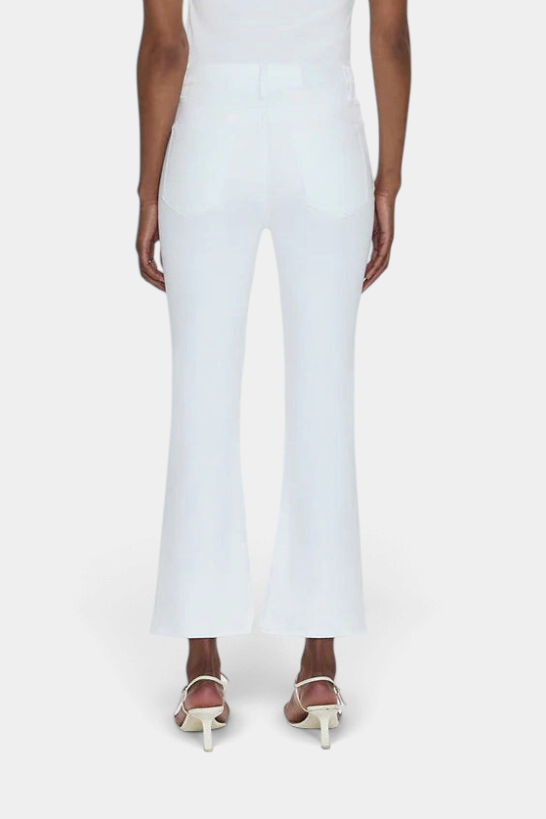 The Copper Shed white high rise crop boot cut jeans on a model from the back view