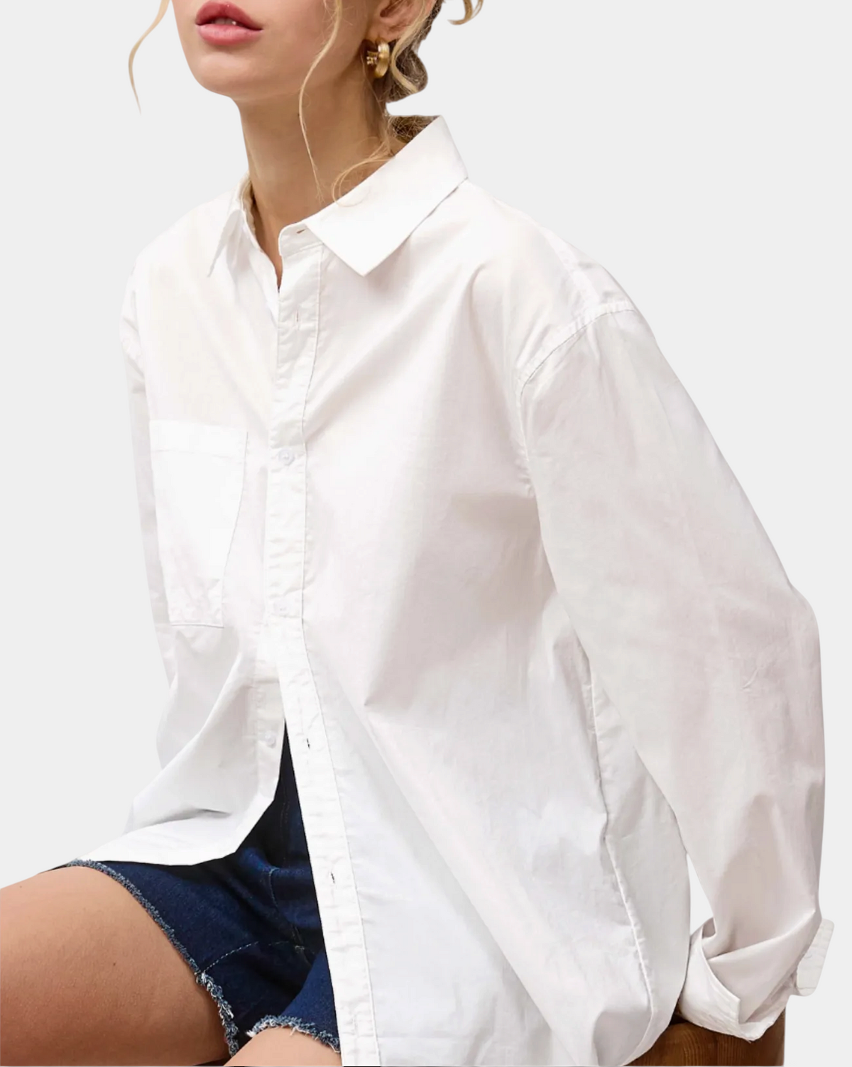 The Copper Shed white oversized poplin button-down shirt with a classic collar and front pocket on a model