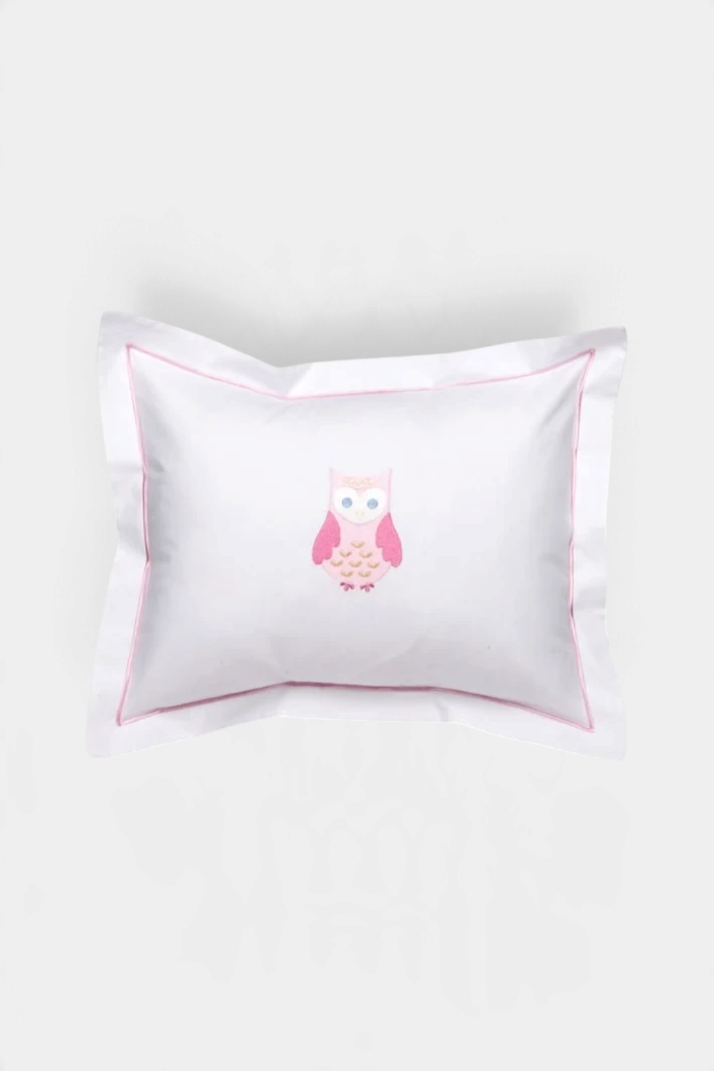 The Copper Shed white cotton percale baby boudoir pillow cover featuring a pink embroidered owl and satin stitch trim.