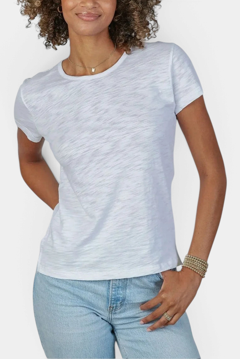 Model wearing The Copper Shed white pima cotton slub short sleeve crew neck t-shirt with light wash jeans