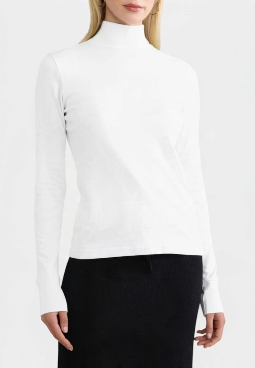 The Copper Shed white long sleeve ribbed organic cotton turtleneck worn by a model