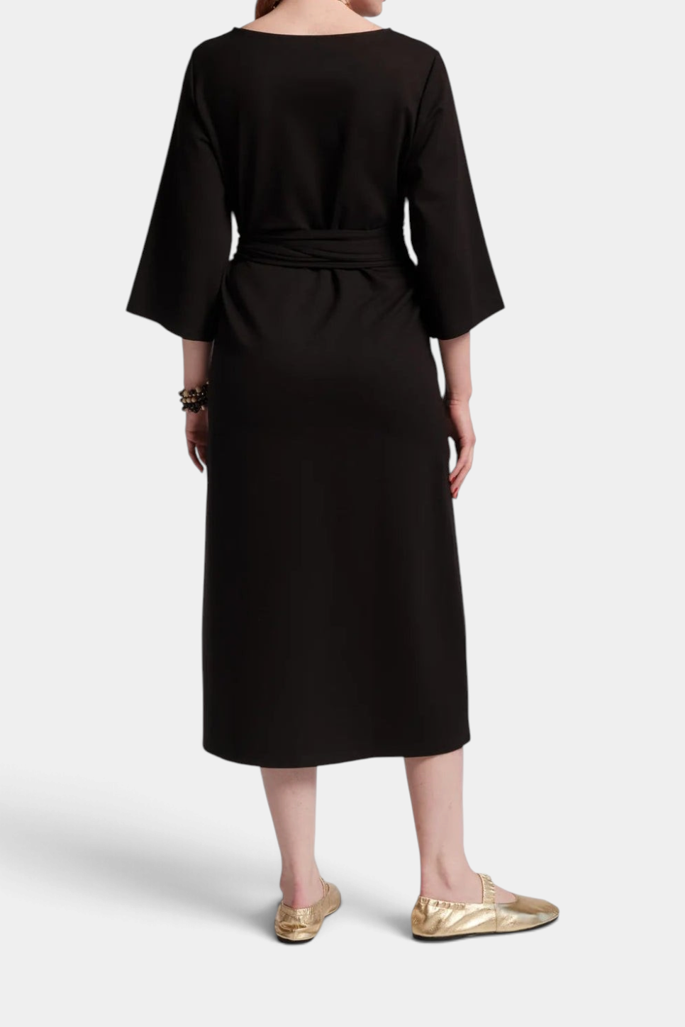 Back view of The Copper Shed Whitney wrap dress in black featuring a midi length, wide sleeves, and a tie waist.